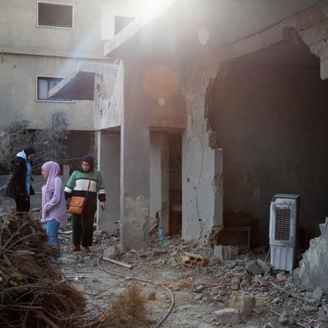 Young women from Lebanon's Baalbek area survey damage to their local neighbourhood caused by attacks by Israeli forces.  